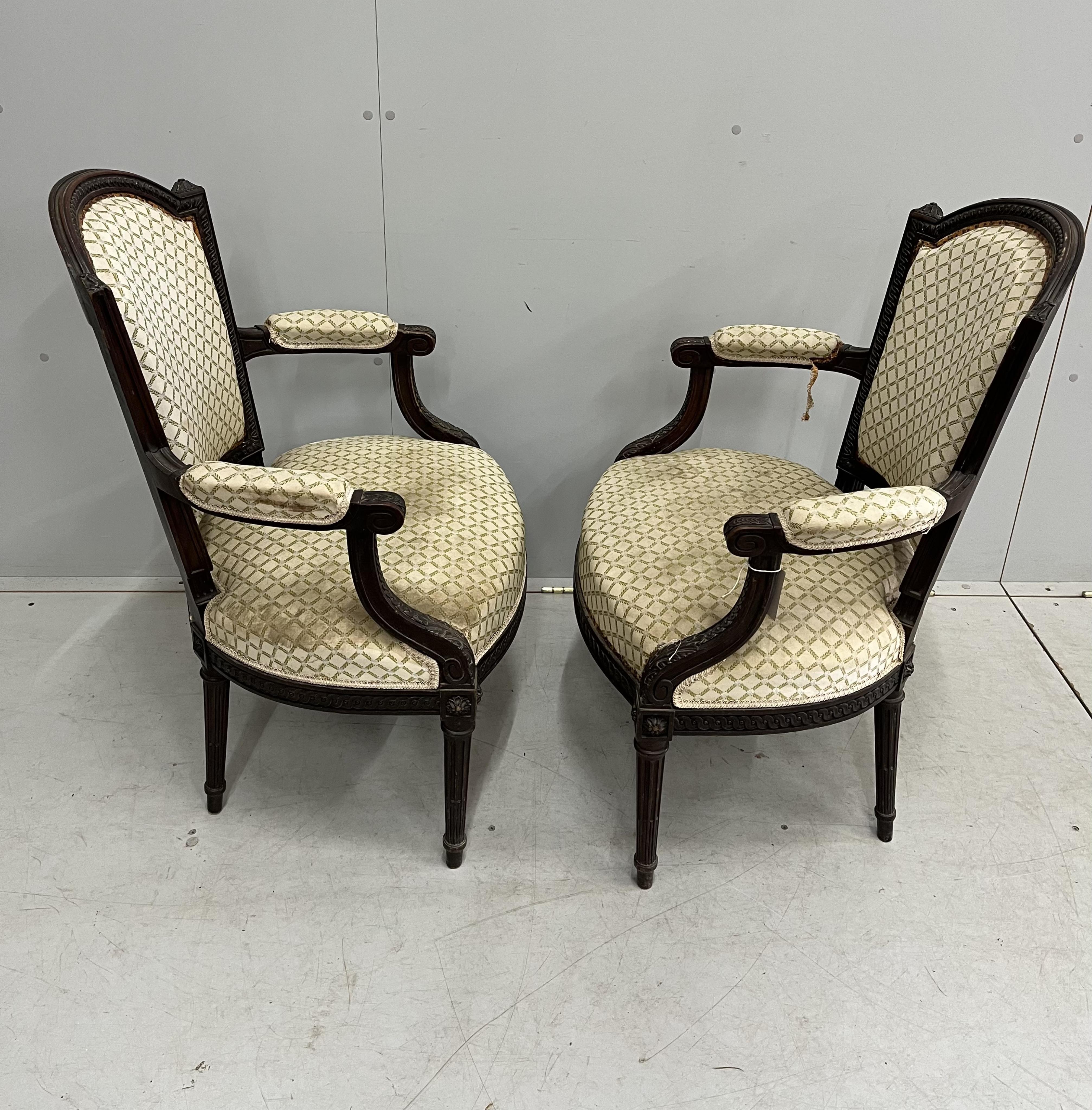 A pair of early 20th century mahogany fauteuil, width 59cm, depth 50cm, height 91cm
